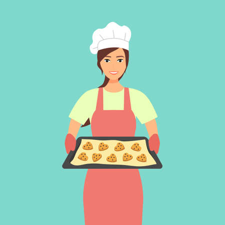 Young woman baking chocolate chip cookies vector illustration. Pastry chef preparing cookies for bakery shop. Housewife holding tray with heart shape cookies character in flat design.のイラスト素材