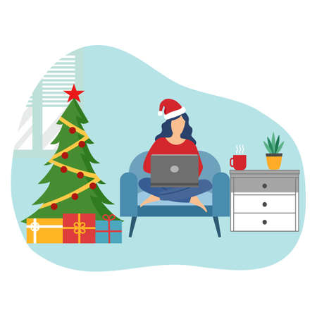 Woman wearing Santa Claus hat using laptop computer at home with Christmas tree and gifts next to her. Christmas celebration at home during covid19 Coronavirus quarantine. Season greetings.のイラスト素材