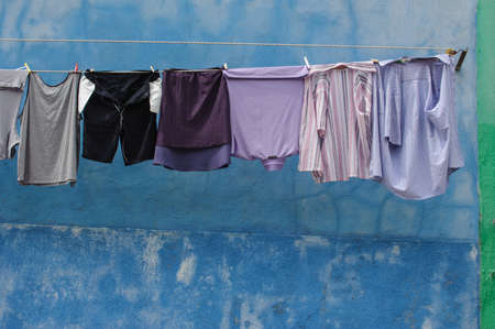 Blue Shirts against a Painted Blue Wallの写真素材