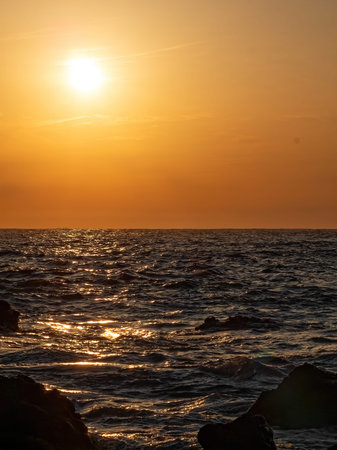 Light reflected by the sun and waves at dusk