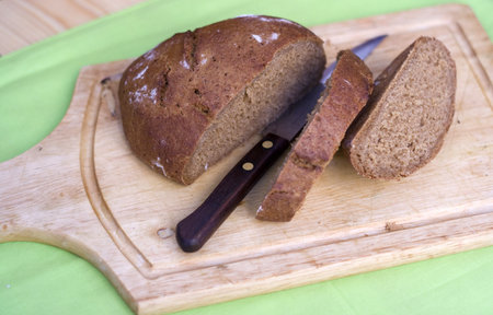 wooden board with sliced bread