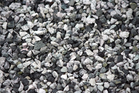 Background of gray granite gravel road metal 