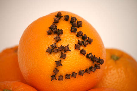 christmas tree on oranges with clovesの写真素材