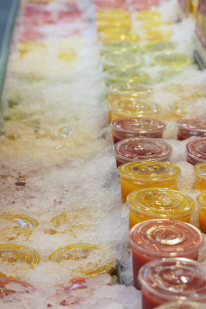 fruit and vegetable juices on ice for sale
