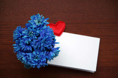 Beautiful bouquet of bright blue flowers in color mugの写真素材