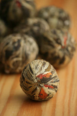Chinese green tea balls with jasmine and marigold calendula  flowersの写真素材