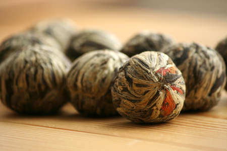 Chinese green tea balls with jasmine and marigold calendula  flowersの写真素材