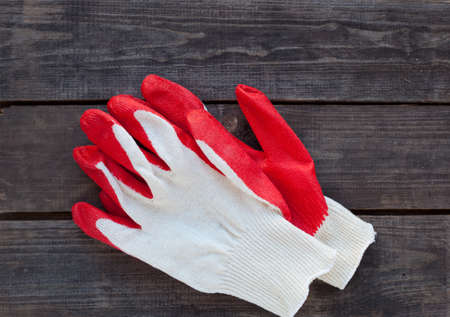 reed and white working gloves ready on rustic woodの写真素材