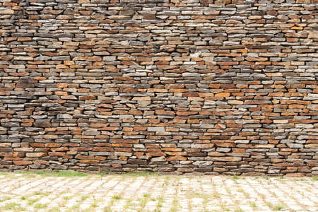 tiling stone wall. Sand stone and grassの写真素材