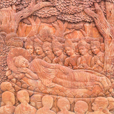 nirvana of buddha carving in thailand templeの写真素材