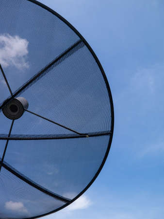 satellite dish and blue sky backgroundの写真素材