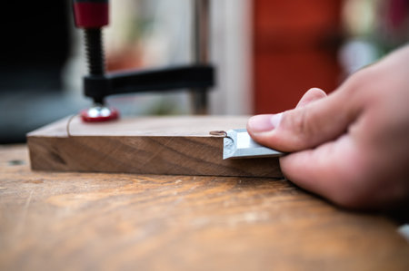 Closeup shot of curled wood-shavings and chiselの写真素材