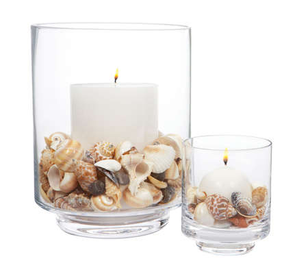 candles with sea shells in glassの写真素材