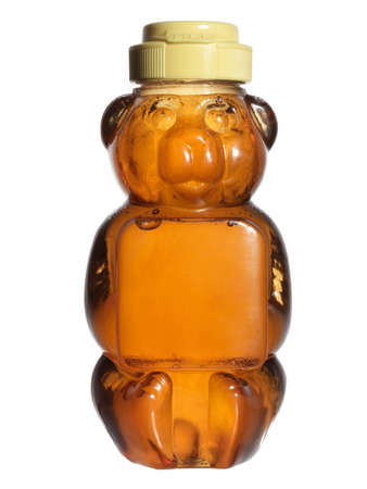 bear-shaped bottle of honeyの写真素材