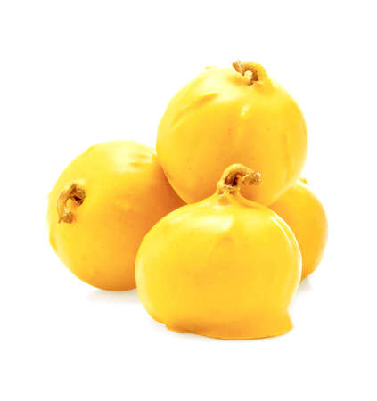 melted white chocolate covering figsの写真素材