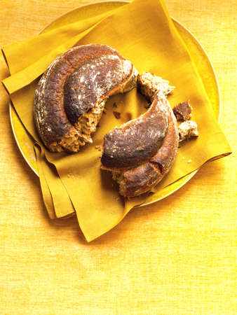 food loaf of bread broken in halfの写真素材