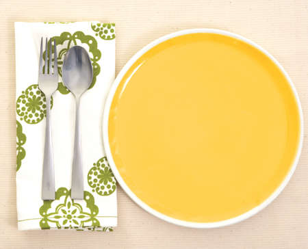 Served place setting: empty dinner plate and silverwareの写真素材