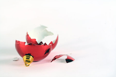 A shattered chrismas ball on a white background