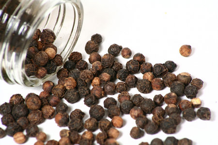 Black pepper from a glass jar.