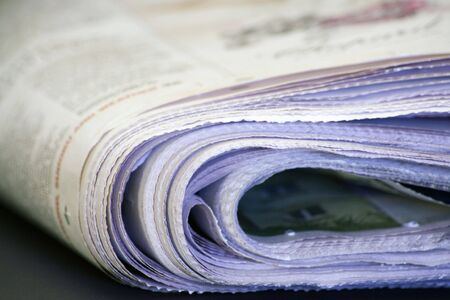 Photo of News papers with a blue light.の写真素材