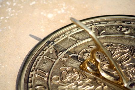 A brass sun dial at 12h26.の写真素材