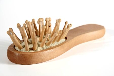 A wooden body brush isolated on a white background.の写真素材