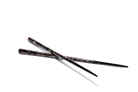 A set of oriental chop sticks on a white background. の写真素材