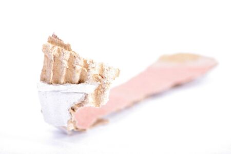 Pease of ripped cardboard on a white background.の写真素材