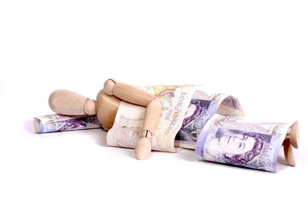 A mannequin sleeping under ten and twenty pound notes. の写真素材