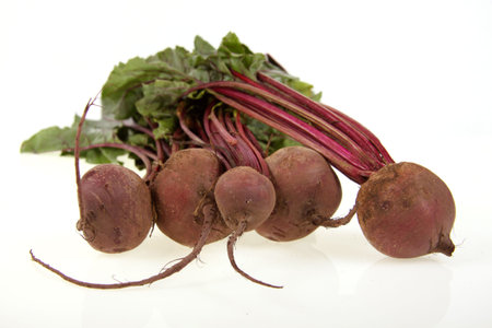 Bunch of fresh organic beetroot on a white background. 