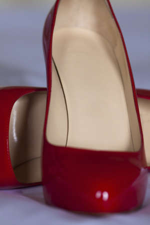 Close-up view of a pair of red high heel shoes with a shallow depth of field. の写真素材