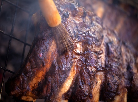 Beef ribs being roasted on the barbeque の写真素材