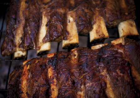 Beef ribs being roasted on the barbeque の写真素材