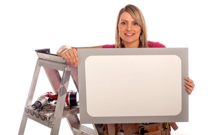 DIY woman with white panel for your advert の写真素材