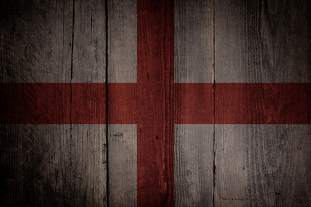 English flag over a grunge wooden background の写真素材