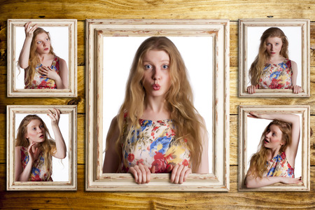 Woman trapped inside five picture frames.の写真素材