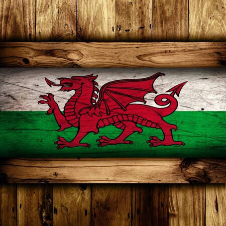 Abstract Welsh flag over a wooden background.の写真素材