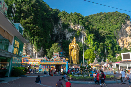 Batu Caves, Kuala Lumpur, 1st May 2019 - Batu Caves temple entrance with world's largest Murugan Statue & colorful stairsのeditorial素材