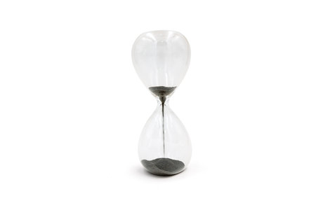 Creative magnetic sand glass hourglass isolated on white background, leadership concept
