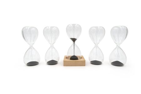 Creative magnetic sand glass hourglass isolated on white backgroundの写真素材