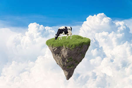 Fantasy floating island with natural and cow, floating island in environmental conceptの写真素材
