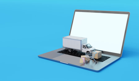 Logistics, supply chain and delivery service concept. A shopping cart on a laptop computer, depicts...