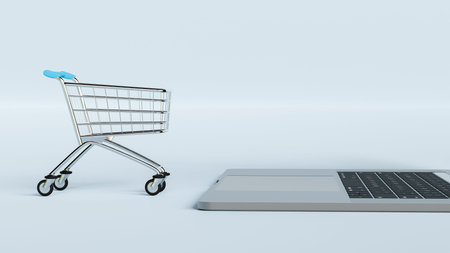 Online shopping. Laptop keyboard with supermarket trolley isolated on white background. 3d render.
