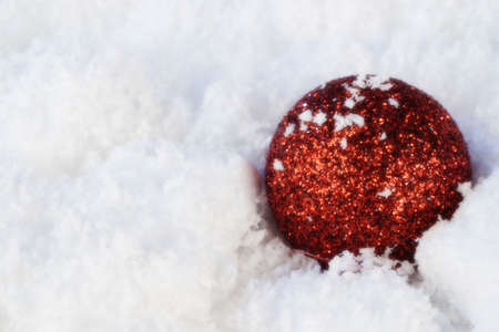 christmas tree ball in snowの写真素材