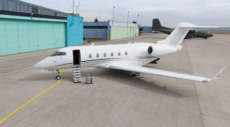 corporate private jet with luggage in frontの写真素材