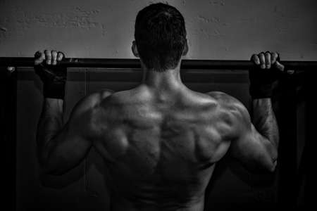 crossfit pull up fitness exercise - back of a manの写真素材