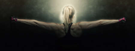 woman fitness workout - holding dumbbellsの写真素材