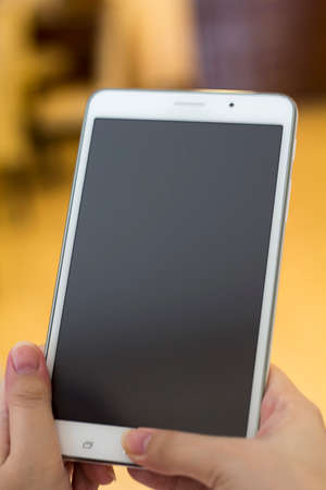 Lady holding phoneの写真素材