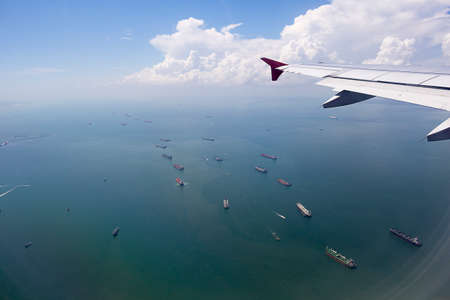 Ships in the ocean view from Airplane windowの写真素材