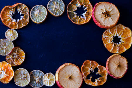 Border frame of fruit slices sun-driedの写真素材